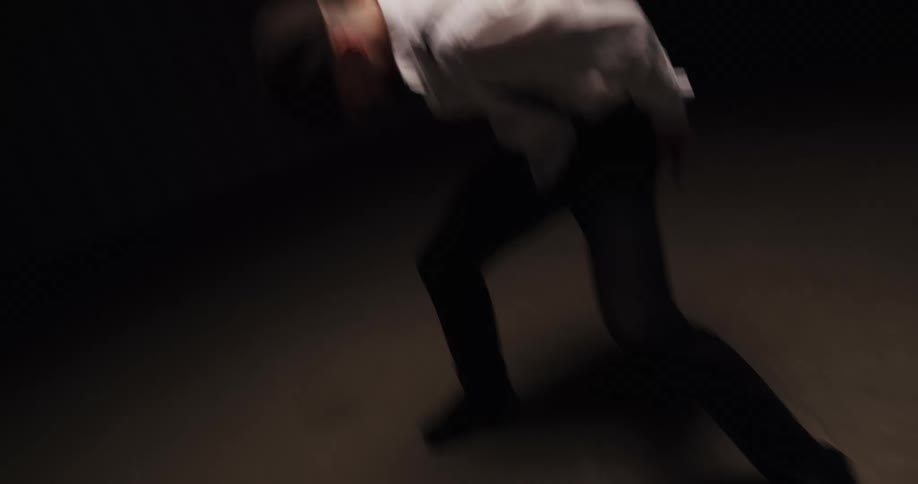 A man spins around as he dances