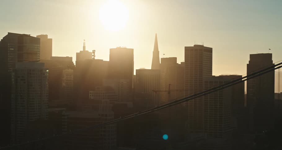 Aerial view of a downtown city at dusk is displayed