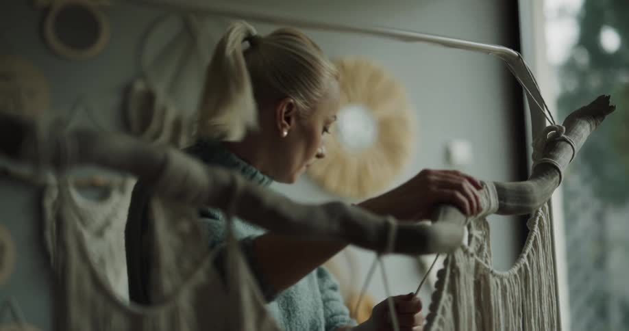 A woman crafting with string