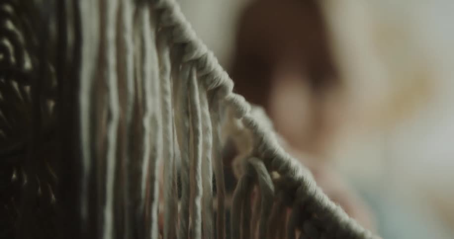 A woman crafting with yarn