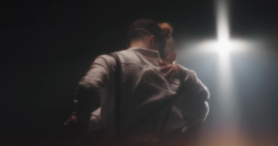 A man an woman approach each other and begin an elaborate dance