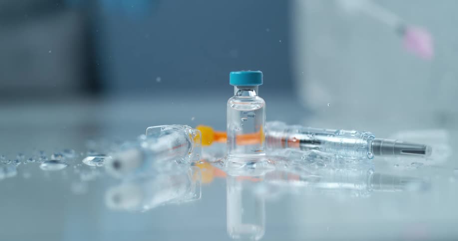 Syringes and falling and bouncing off a reflective surface