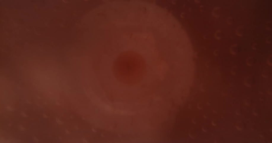 The liquid gets sucked into the sphere