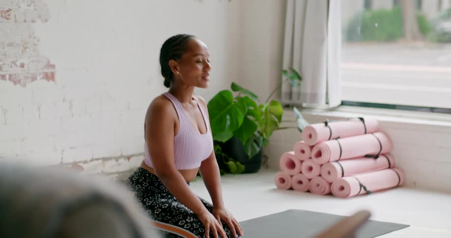 A yoga instructor in a studio