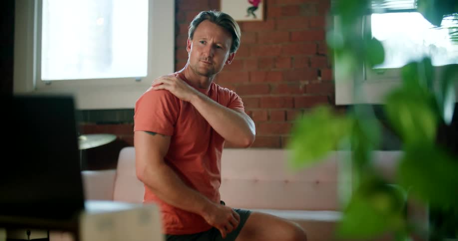 A man talking and stretching