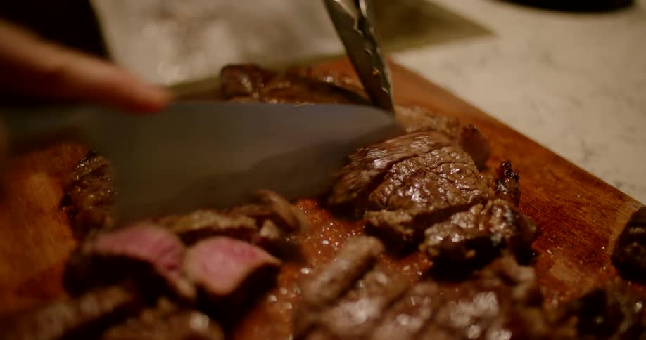 Cooked steak being cut