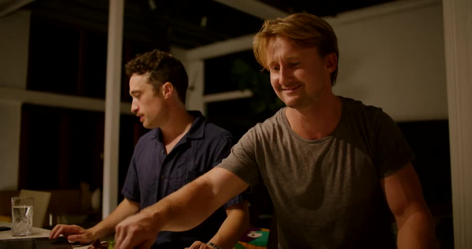 Two men preparing to eat
