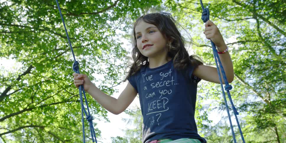A child on a swingset