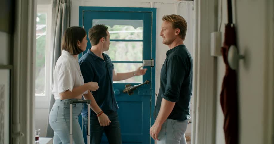 Two men and one woman talking together
