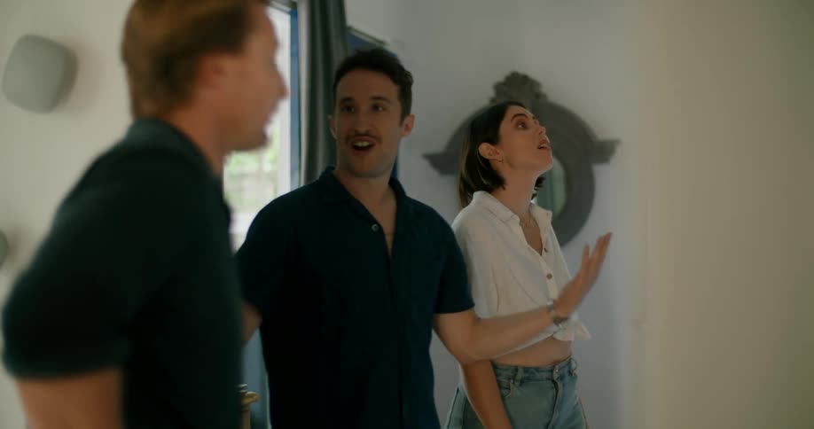 Three friends are looking at a house together