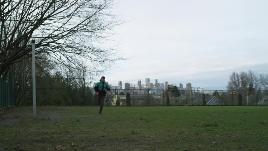A man running around a field