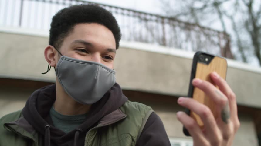 A man standing with a phone
