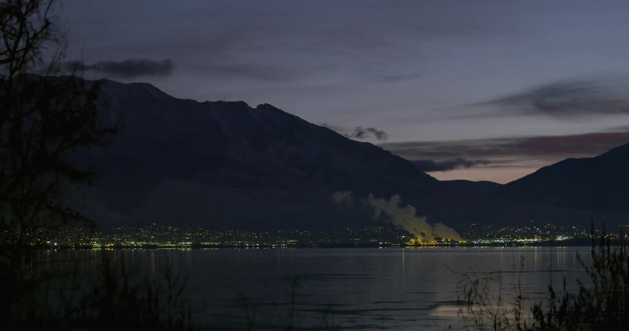 Small town in the coast of a lake in the mountains at sunset