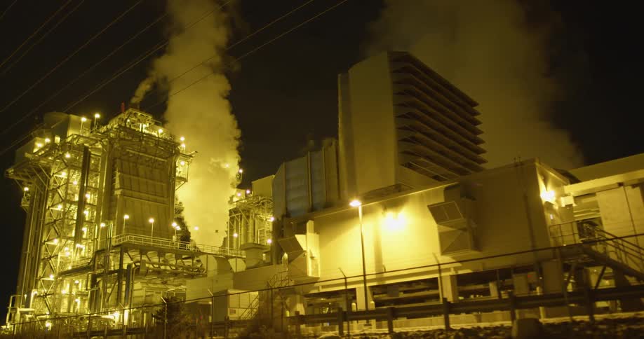 The lights surround the factory at night