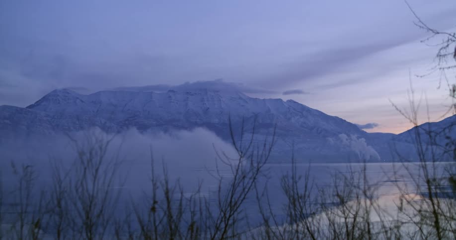 Clouds flow over the icy tundra