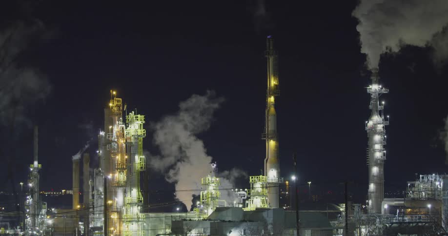 Smoke rising out of a refinery and factory