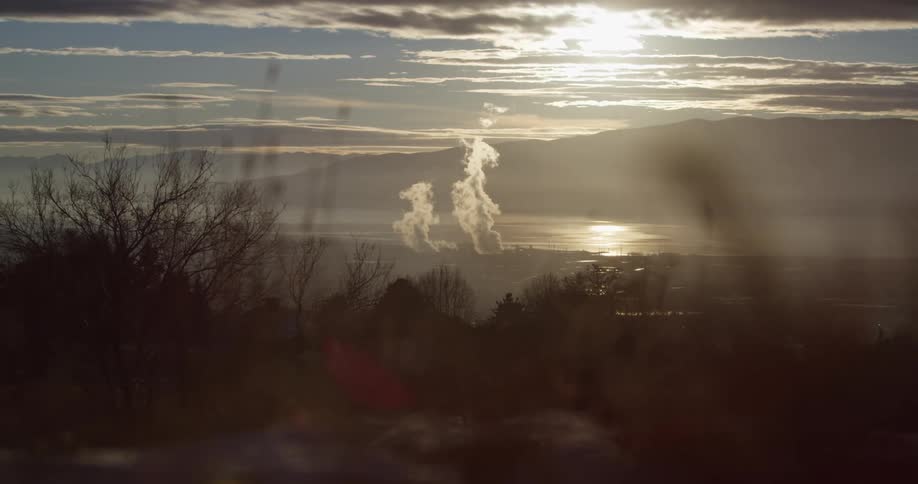 Smoke billowing from an area far from the camera