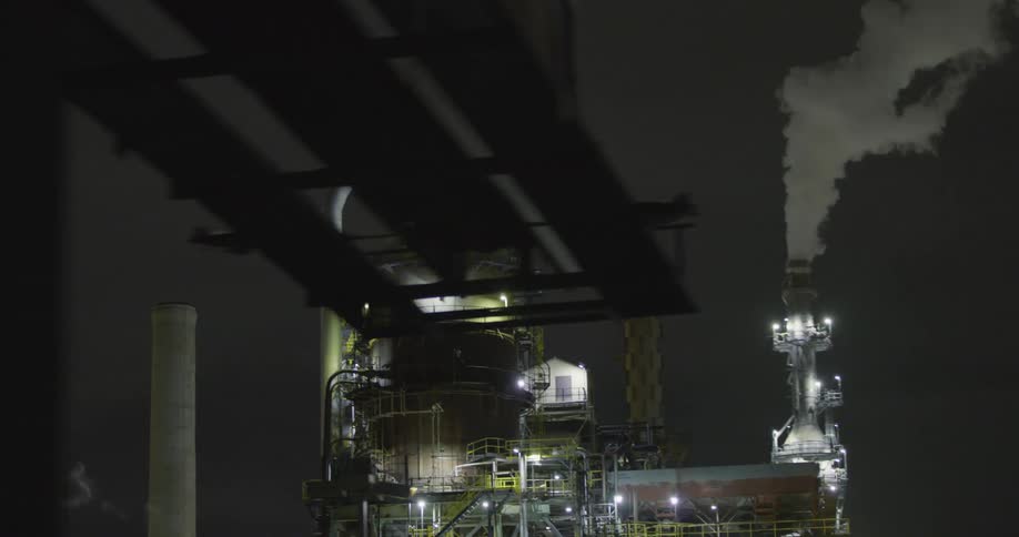 Smoke is rising from the oil refinery