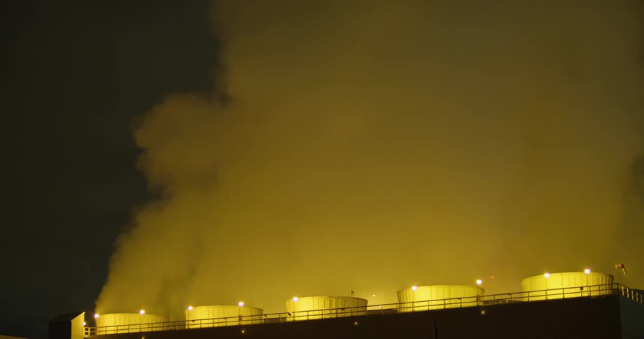 Smoke rising out of stacks at a power plant
