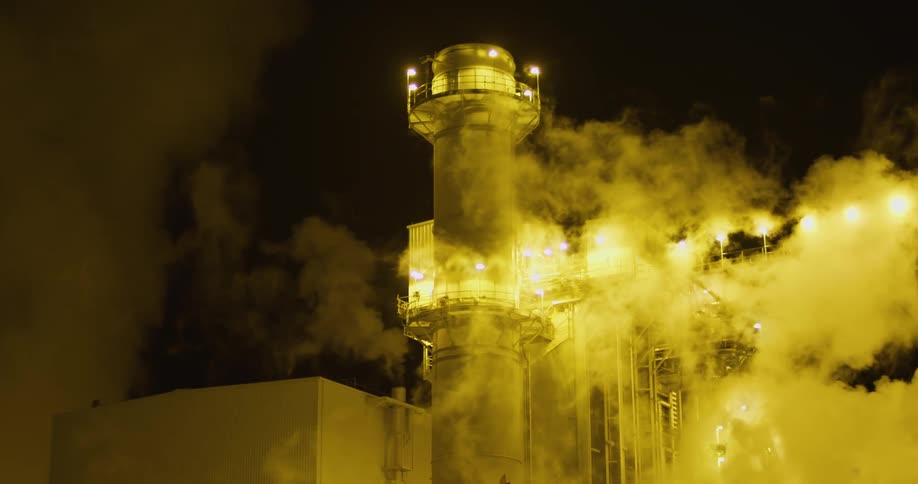 Smoke floating around power plant towers