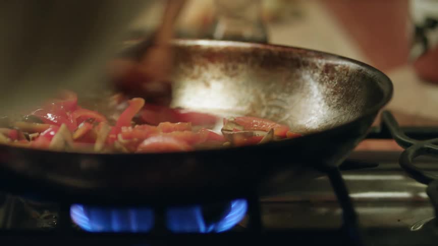 A close up of peppers cooking