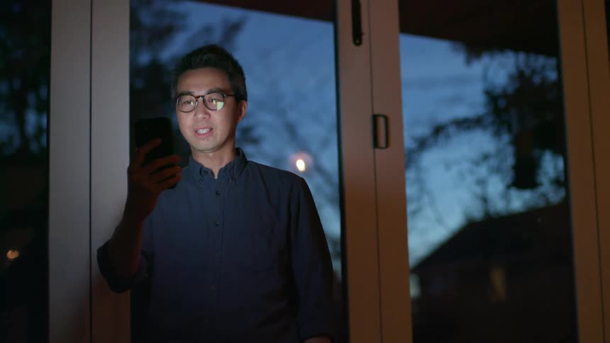 A man talking to a smart phone