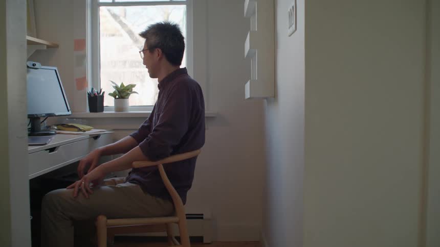 A man sitting at a desk in an office