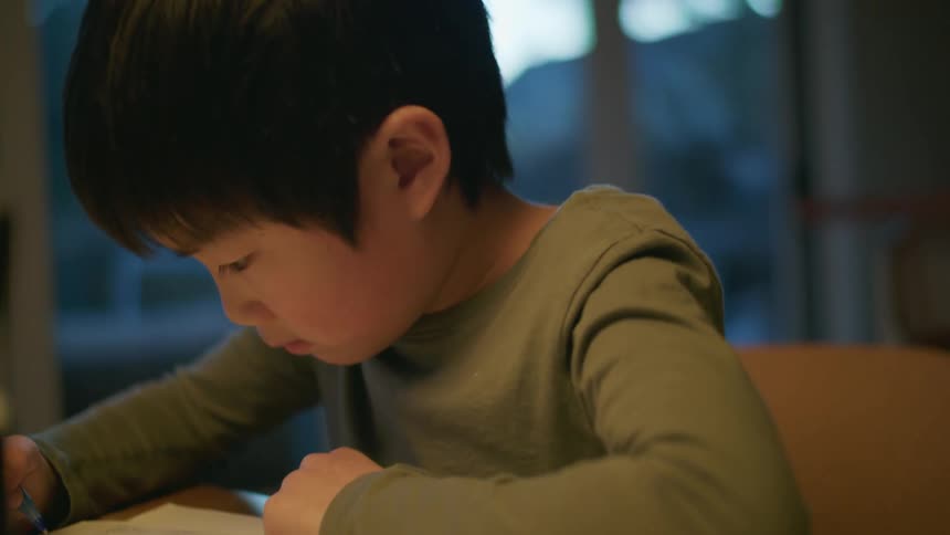 A child writing on a paper