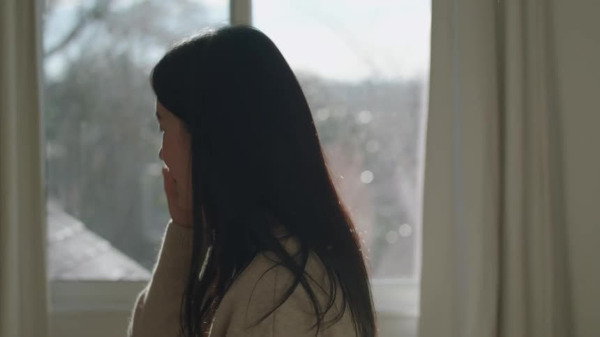 A woman answering a phone call