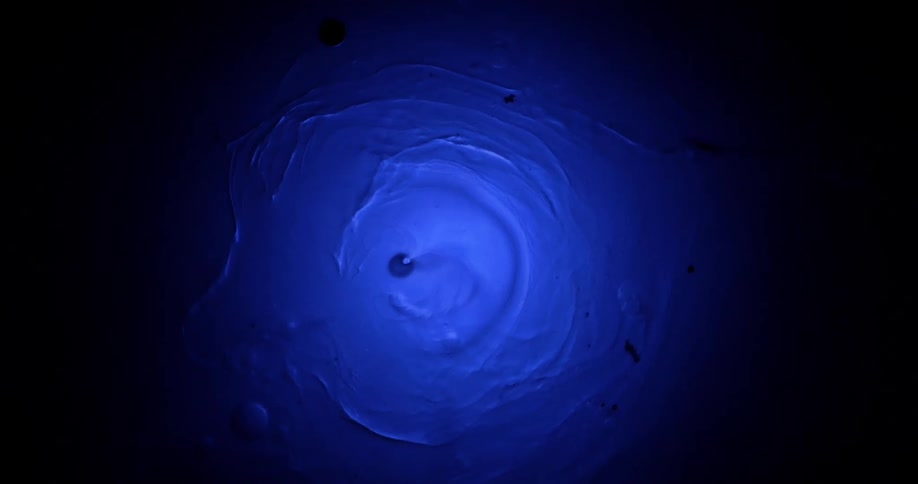 White blue and black colors that look like paint and water