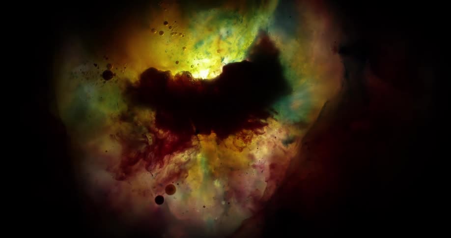 Yellow green and black colors that look like clouds and planets