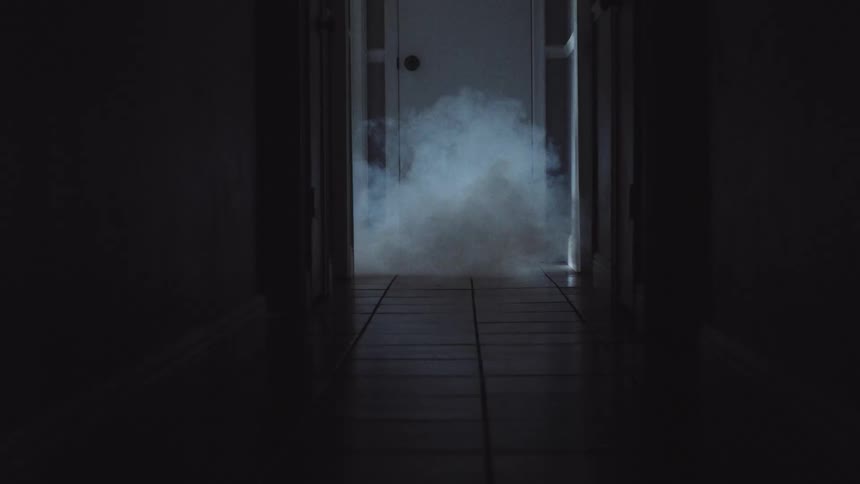 A smoke machine that is filling a hallway