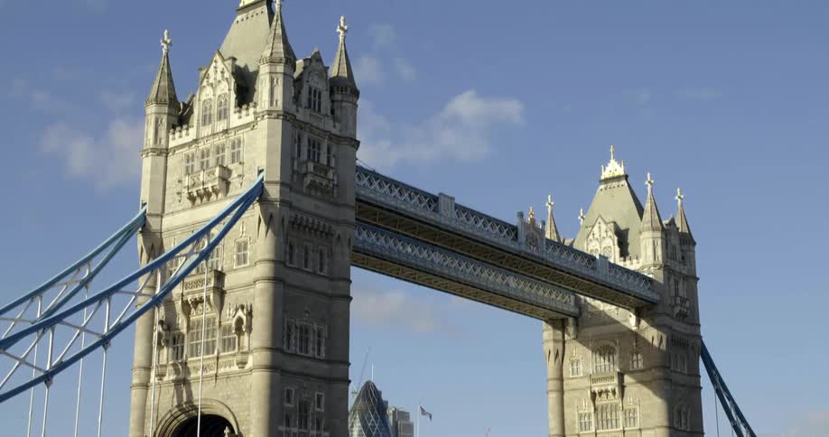 Vehicles travel across the iconic tower bridge in london england