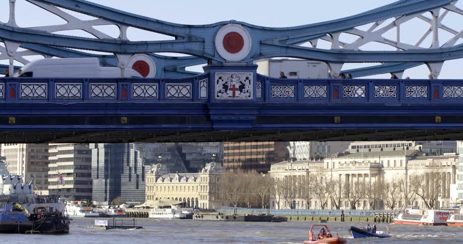 Cars are driving on a bridge over the ocean water