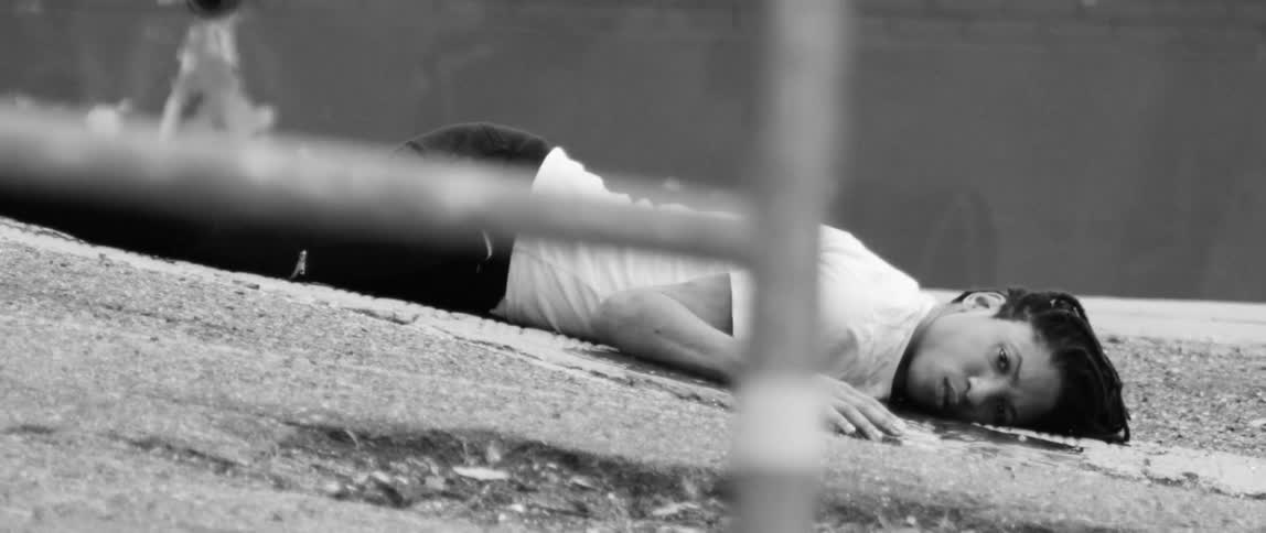 A man lies dead on the concrete