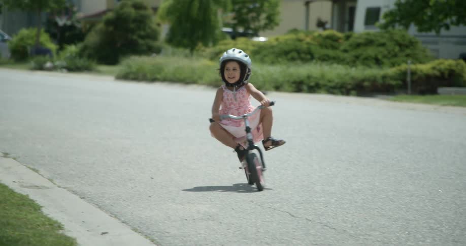 A child playing on a bike