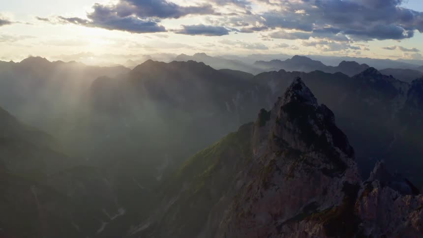 The top of a mountain range as the sun sets