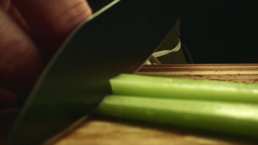 A man cutting celery