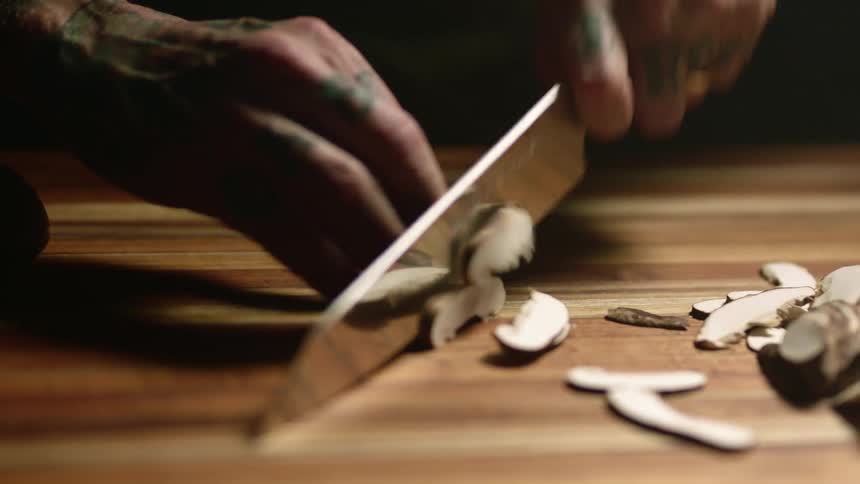 A man cutting up food