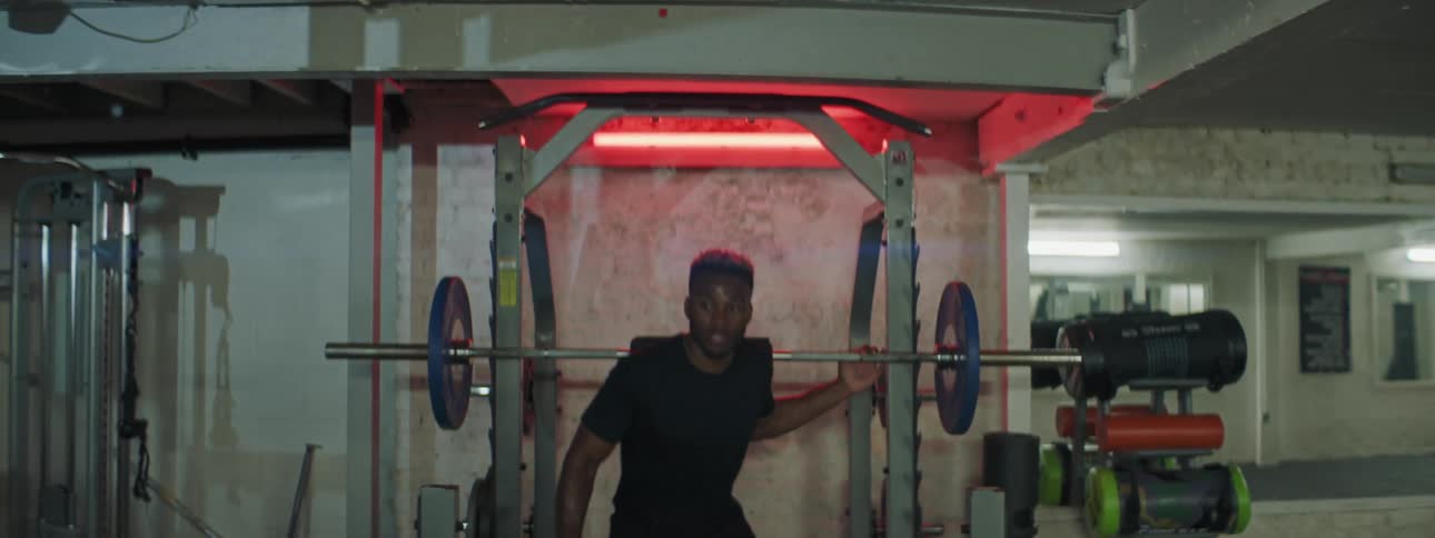 A man lifting weights in a gym