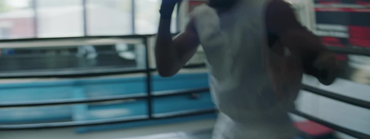 A man is boxing in the ring
