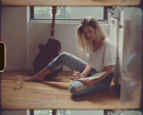 A woman sitting on the floor