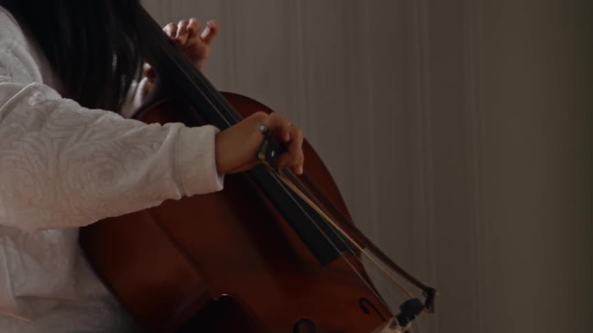 A woman playing a cello