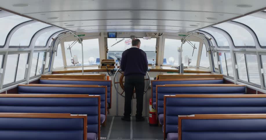 A man steering a boat