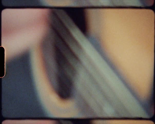 A person playing a guitar with a pick