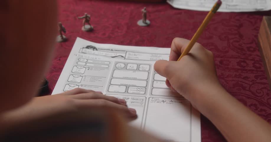 A child doing homework with a pencil