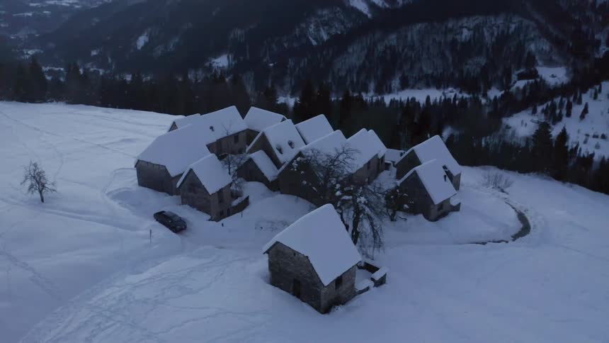 Aerial view of houses in winter is displayed
