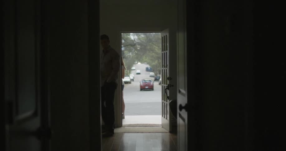 A man walks into a house