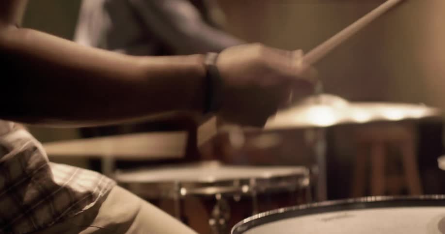 Close up of a person playing drums