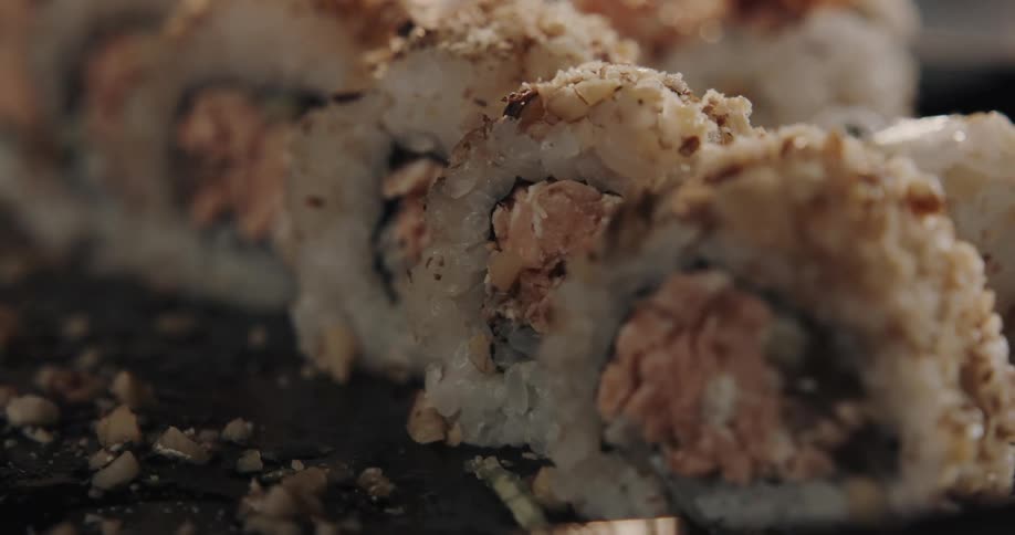 Sliced sushi is lining the dish